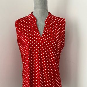 Red and white polka dot sleeveless top.